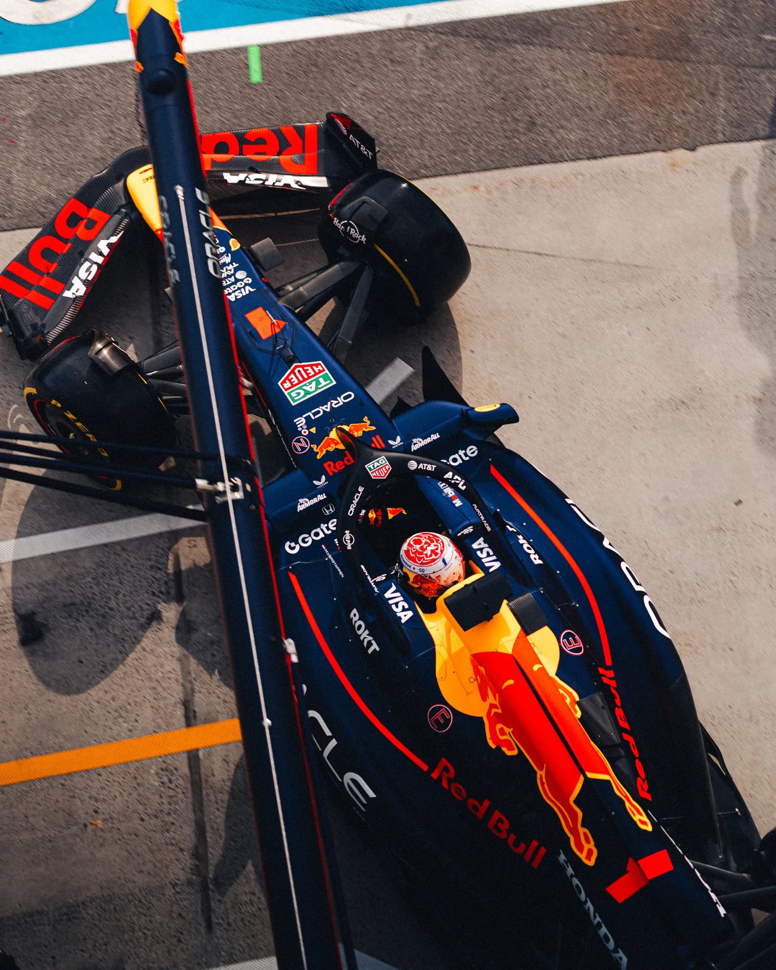 Red Bull rolling out of its pit box, seen top-down