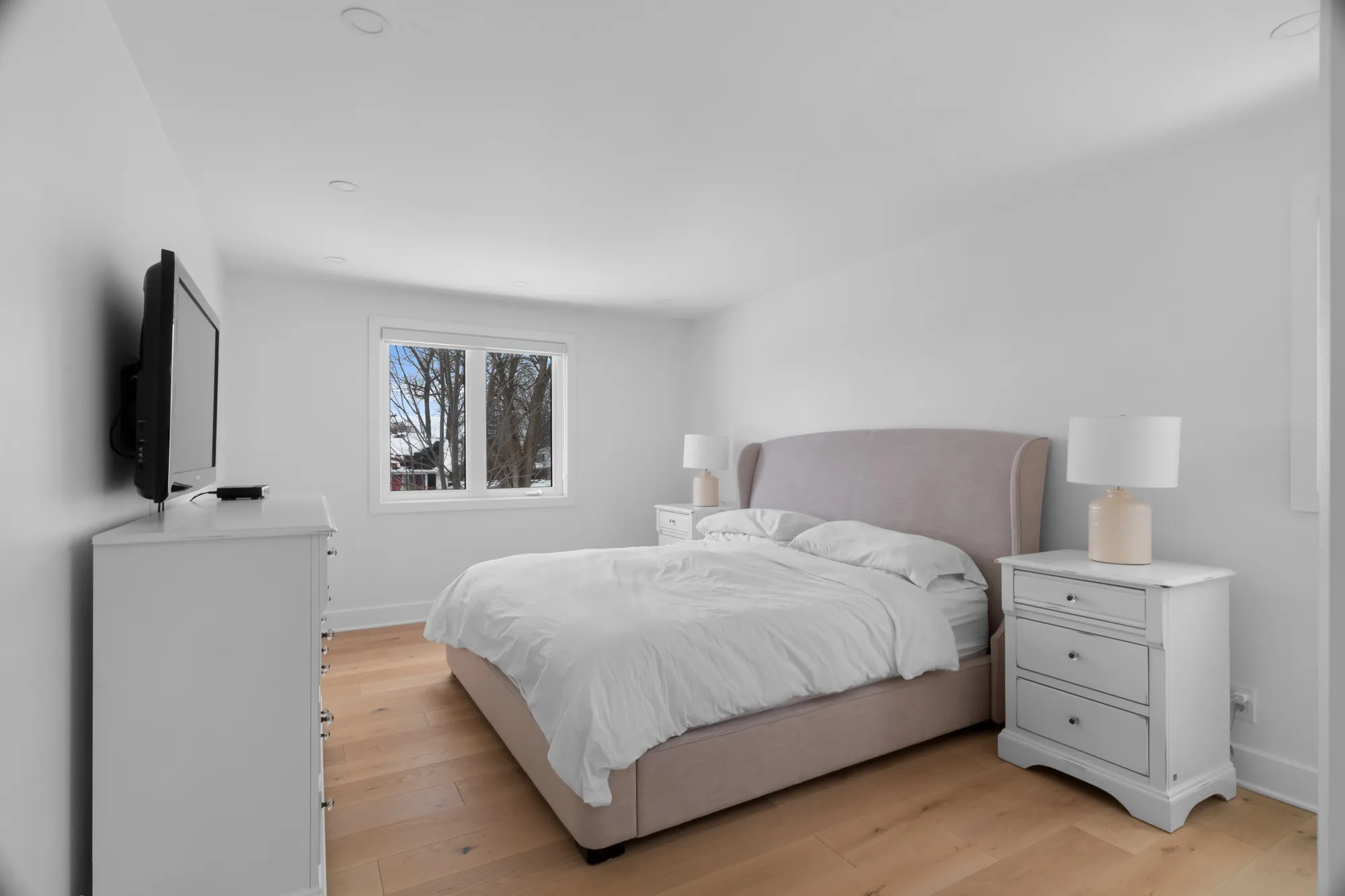 Primary bedroom in soft neutrals