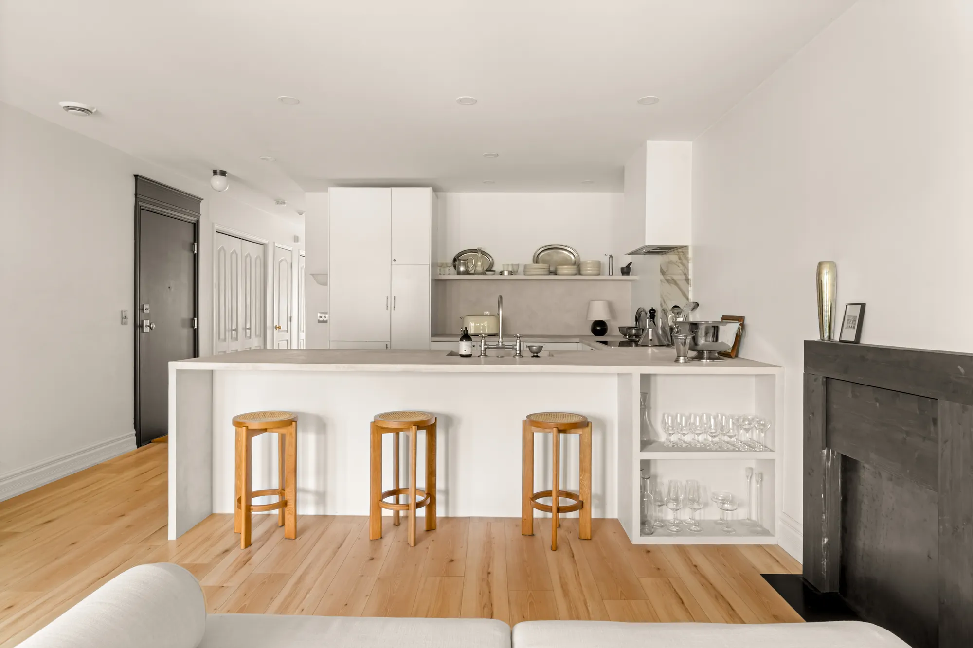 Kitchen peninsula with wooden stools